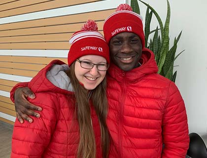 Two Safeway employees standing together in the Sobeys Corporate Office.