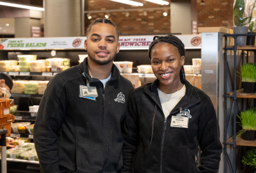 In this image, there is a picture of employee woman and man together.