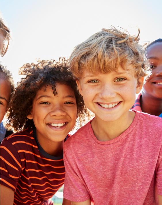 In this image, there is a child with a smiling face.