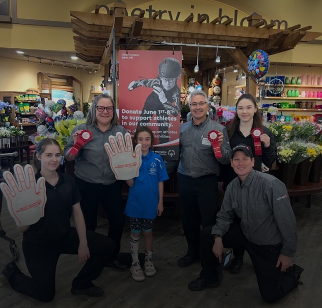 In this image, a group of people is taken a picture.